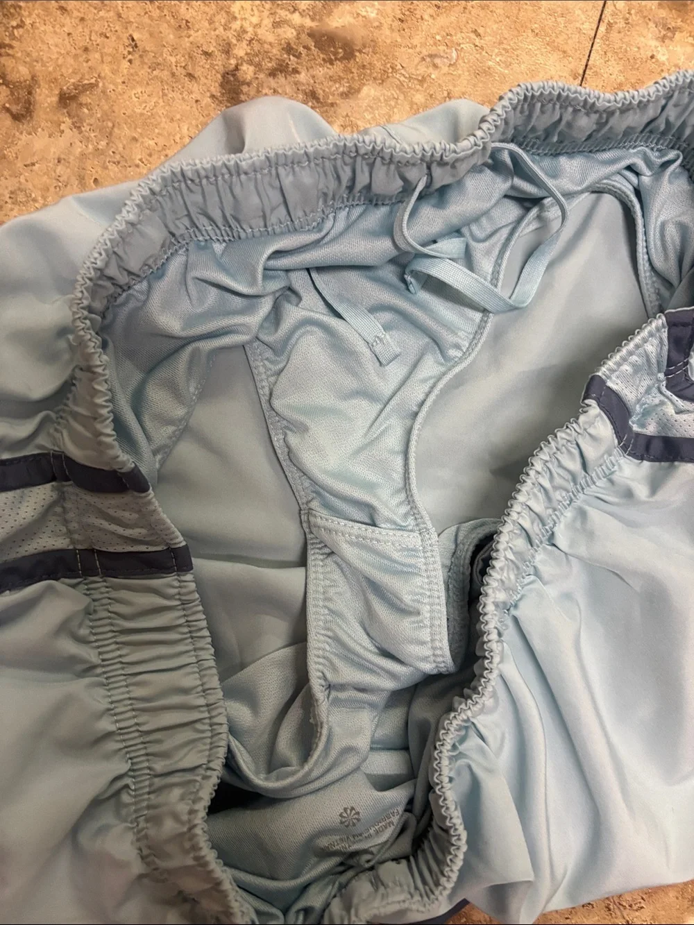 Nike - Women’s Sky Blue Athletic Shorts with Navy Trim (size X-Large)